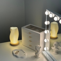 a vanity with a mirror and a jewelry box
