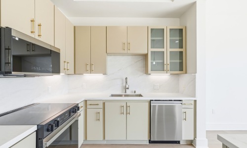 kitchen with ample counter-space, modern appliances and bright lighting