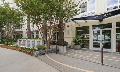a building entrance area with trees