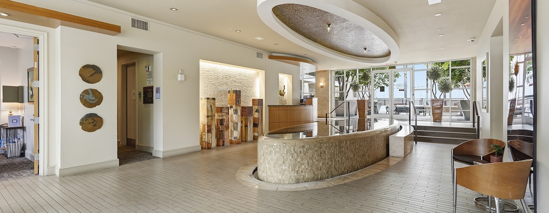 a clubroom with a structure and chairs
