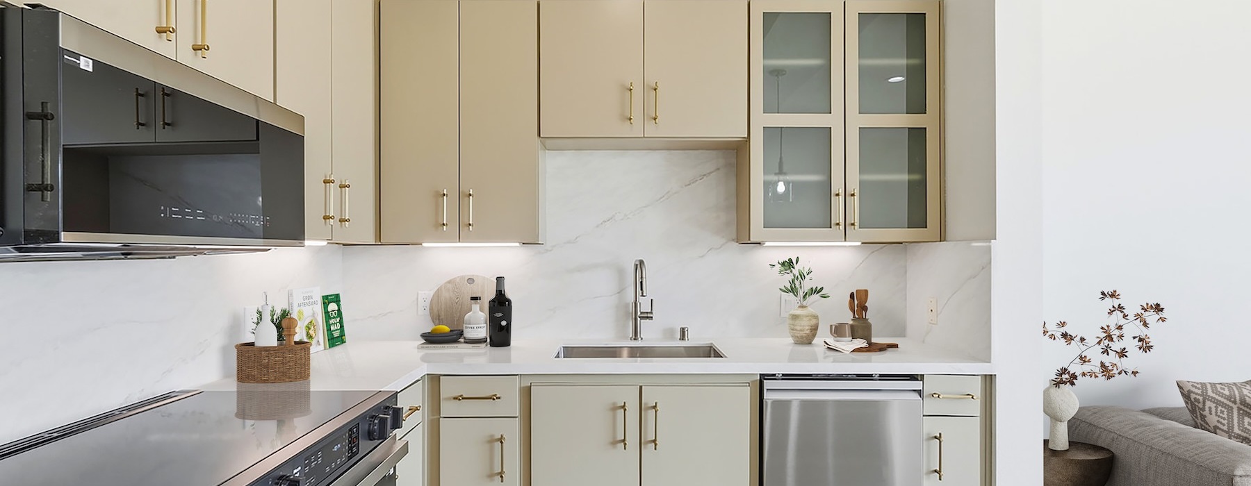 a kitchen with white and wood cabinets