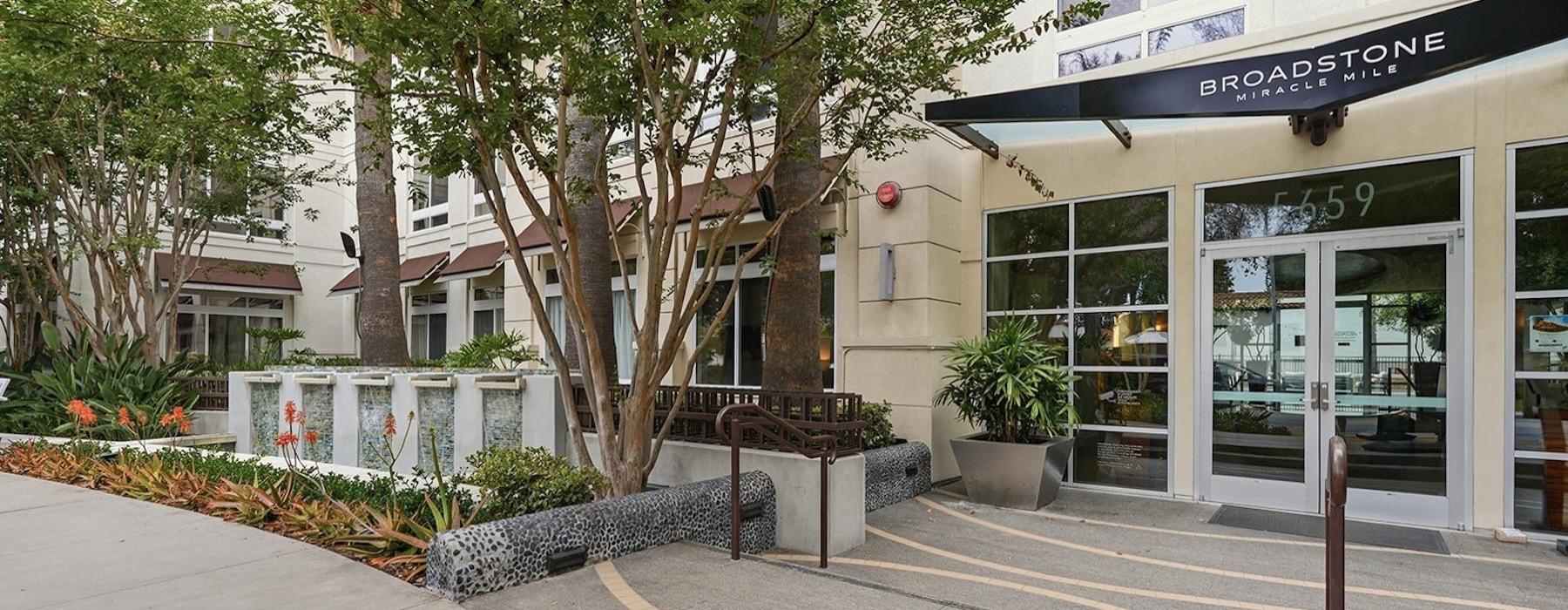 a building entrance area with trees
